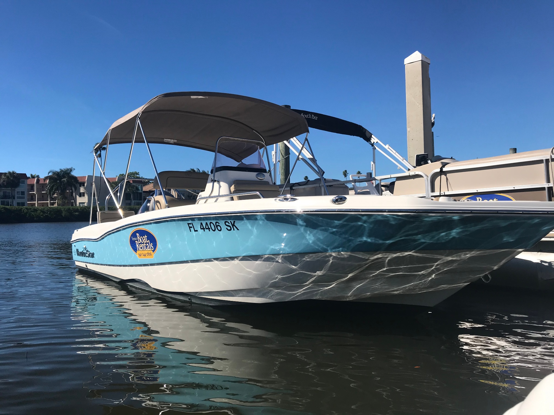 Venice Boat Rental hybrid deck boat at the marina